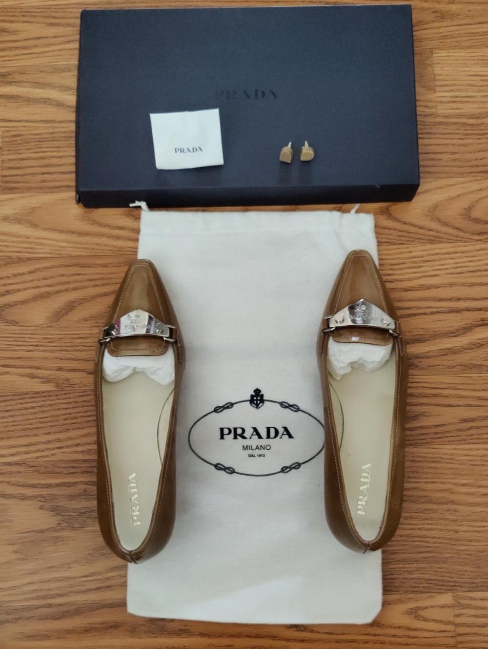 NWT - Prada Tan Leather Pointed-Toe Heels In Loafer Style with Silver Logo